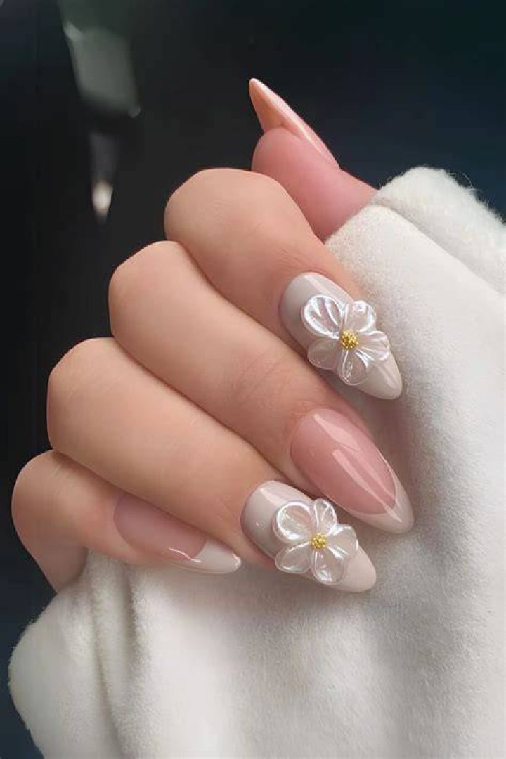 3D sculptural nail art with raised flowers, gems, and chrome accents for 2026